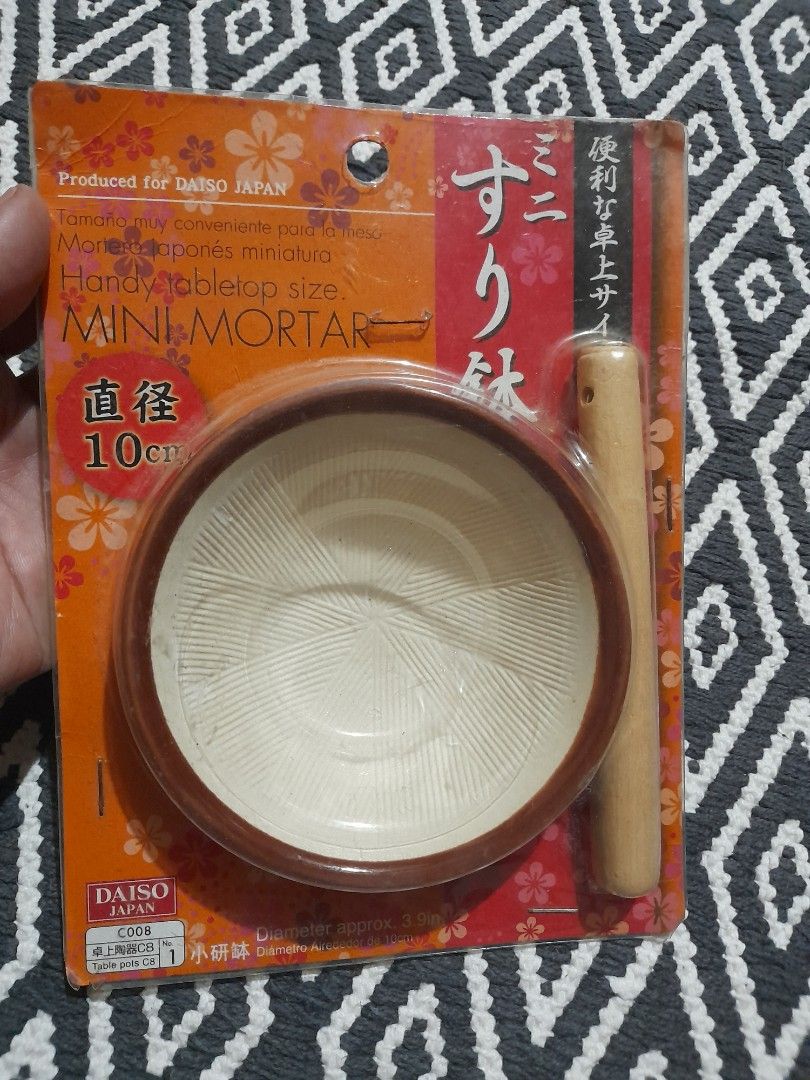 Daiso Japan Mini Mortar and Pestle 10cm (Category: Coffee & Tea Tableware) located in Bocaue. Submitted by marajapansurplus (Listing ID 1467483979, Image 2). Description: - Authentic Daiso Japan Japanese-style mini mortar and pestle set - Like.new, sealed in original plastic wrap with backing card - 10cm diameter compact size, perfect for tabletops - Ceramic mortar bowl designed with a ribbed interior for efficient grinding - Includes a matching 