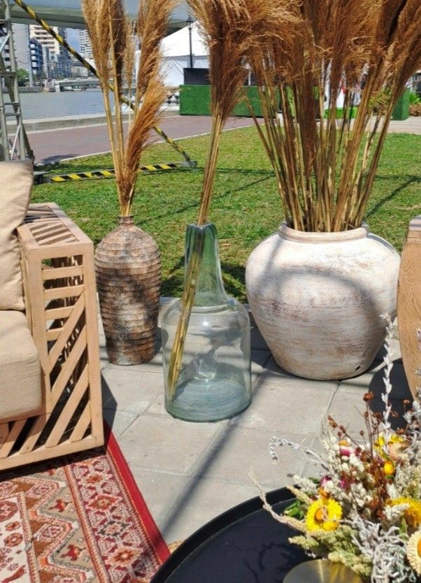 Damajuana/Demijohn Bottle (Category: Vases & Decorative Bowls) located in Quezon City. Submitted by pile.of.stuff (Listing ID 1467386225, Image 3). Description: Damajuana/Demijohn Bottle - Crafted from thick, heavy-duty recycled glass with a sturdy base - Ideal rustic decor piece for living room corners, entryways, or hallways - used once for an event - Dimensions: - 5 Units Available.