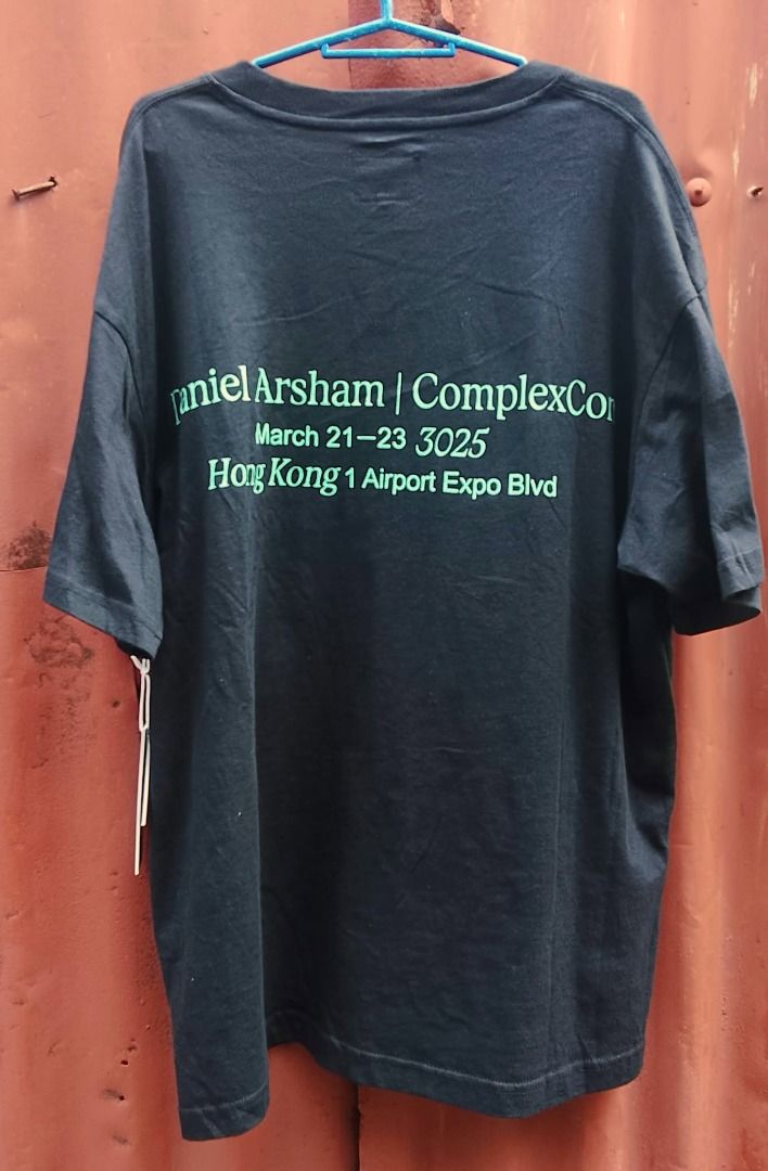 Daniel Arsham x ComplexCon Hong Kong T-shirt (Category: Tshirts & Polo Shirts ) located in San Jose del Monte. Submitted by danielraq81550 (Listing ID 1467411449, Image 2). Description: - Item: Daniel Arsham x ComplexCon Hong Kong T-Shirt - Color: Black - Size: Medium (M) - Condition: Brand new with original store tags attached - Details: Green statue graphic on front, text on back, and ComplexCon Hotel logo on the sleeve - 100% authentic and lim