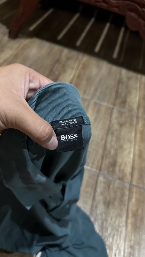 DARK GREEN BOSS POLO SHIRT (Category: Tshirts & Polo Shirts ) located in Manila. Submitted by urban.vintage (Listing ID 1467557359, Image 3). Description: ISSUE: FADED LINE COLLAR , UNDERARM STAIN (NEED WASH) MOP :GCASH (NO COD) SHIP VIA: LALAMOVE & J&T LOCATION: PASIG CITY LENGTH: 29 WIDTH :25.