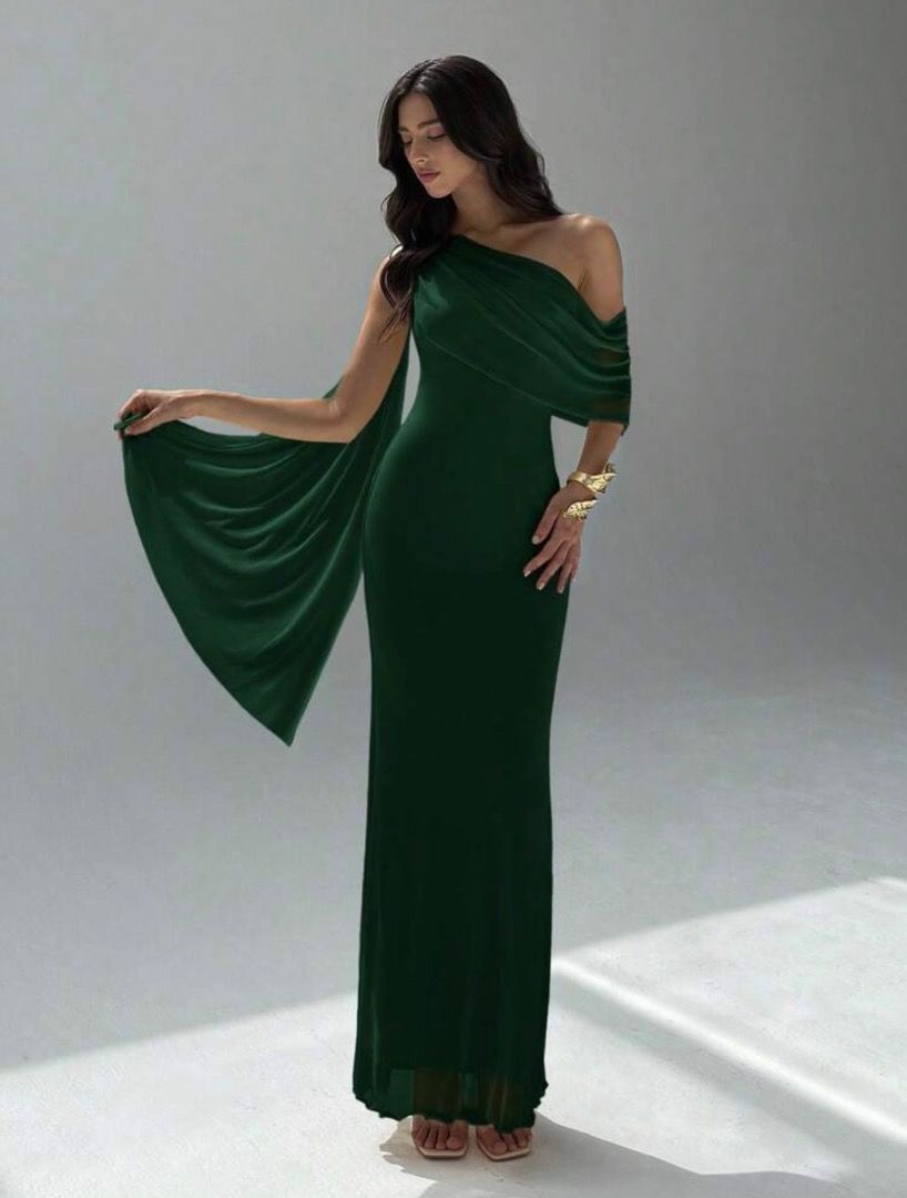 Dark Green One-Shoulder Draped Maxi Dress (Category: Dresses) located in Bacolod City. Submitted by veeebee.4 (Listing ID 1467469821, Image 2). Description: - Color: Deep forest green - Style: One bare shoulder with a chic draped fabric overlay - Fit: Floor-length maxi with a flattering slim silhouette - Material: Stretchy mesh that hugs your curves comfortably .