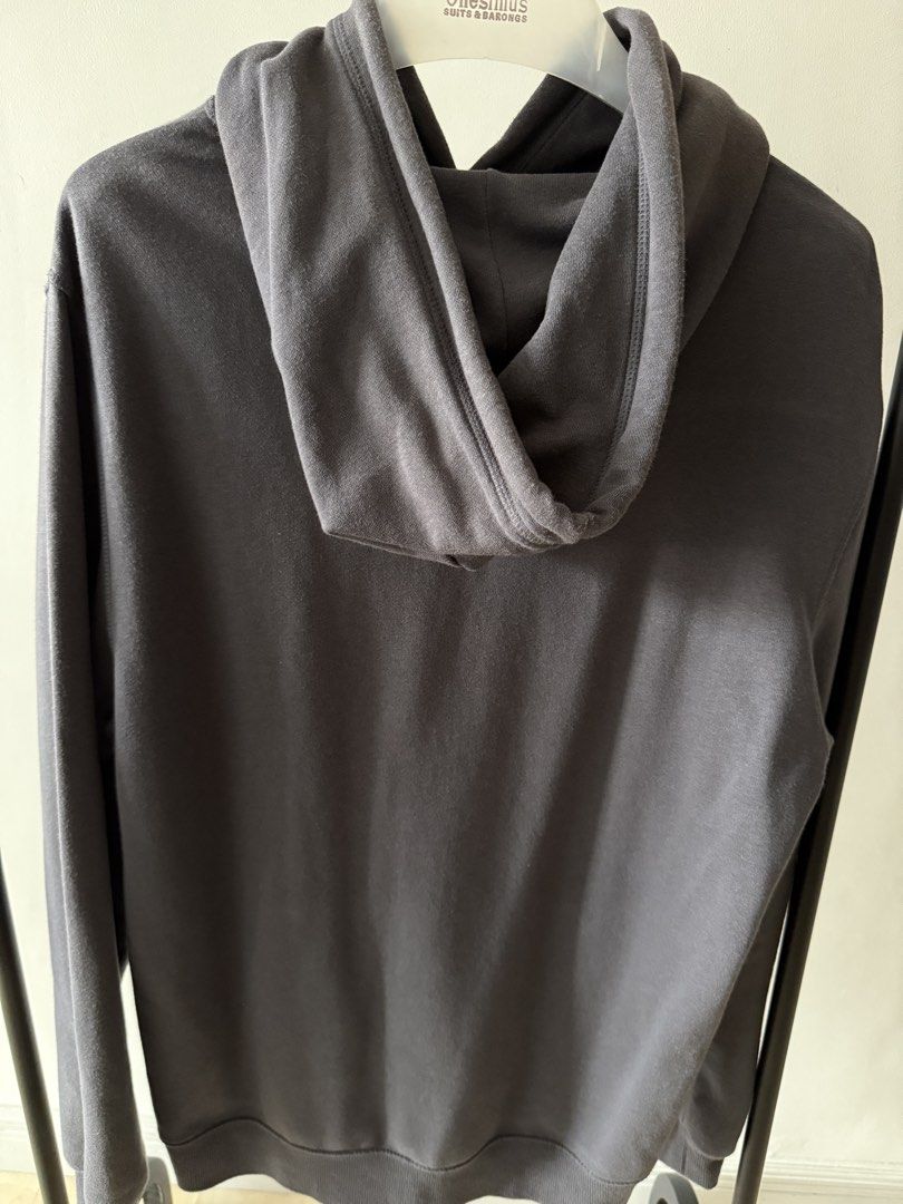 Dark Grey Hoodie Pullover with Pocket and Drawstrings (Category: Coats, Jackets and Outerwear) located in Paranaque City. Submitted by freshlysteezed (Listing ID 1467447286, Image 3). Description: - Color: Dark Grey - Material: Soft, comfortable cotton fabric - Features: Front kangaroo pocket & matching hood drawstrings - Design: Ribbed cuffs and hem to maintain shape - Fit: True to size - Ideal for: Casual daily wear and cooler weather.