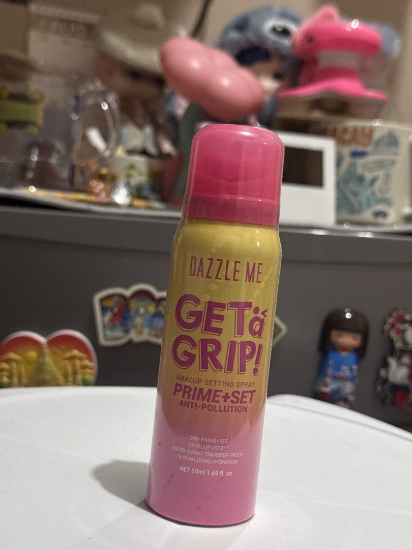 Dazzle Me Get a Grip Makeup Setting Spray 50ml (Category: Makeup) located in Quezon City. Submitted by martitay02 (Listing ID 1467427707, Image 1). Description: - Product: Dazzle Me Get a Grip Makeup Setting Spray - Size: Travel-friendly 50ml (1.69 fl oz) bright yellow and pink bottle - Hold & Finish: 24-hour long wear; water, sweat, and transfer-proof - Formula: Prime and set with anti-pollution benefits - Skin Benefits: Contains 7x skin-loving 