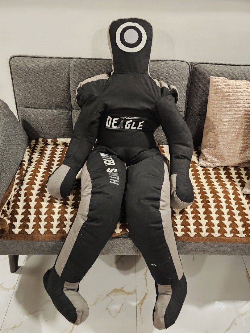 Deagle Master Smith Grappling Dummy (Category: Combat Sports) located in Makati City. Submitted by richpaul_ (Listing ID 1467534076, Image 3). Description: - Brand/Model: Deagle (Master Smith edition) - Color: Black and grey - Design: Includes arms, legs for submissions/throws, and a circular head target - Material: Heavy-duty, durable fabric construction - Ideal For: Wrestling, Brazilian Jiu-Jitsu (BJJ), and MMA solo training. P.S- iritang irita