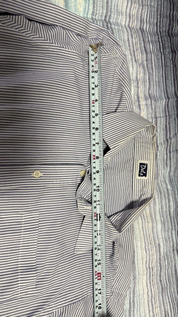 Dels Blue White Striped Long Sleeve Button-Up Shirt (Category: Formal Shirts) located in Quezon City. Submitted by kobeeeee_12 (Listing ID 1467530452, Image 3). Description: - Brand: Dels - Design: Blue and white stripes with classic collar and front button closure - Features: Single chest pocket, long sleeves with button cuffs, structured fit - Measurements: Length ~30 inches, Shoulder width ~18 inches - Versatility: Ideal for office wear or sma