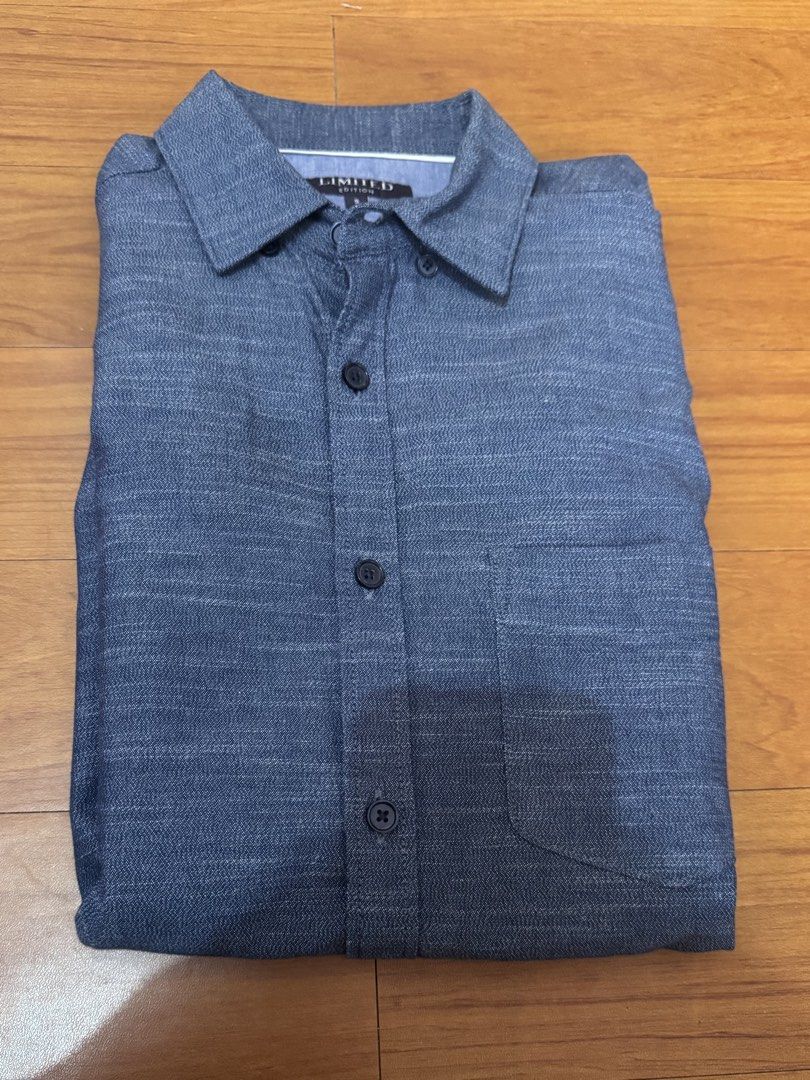 Denim Blue Short Sleeve Button-Down Polo (Category: Formal Shirts) located in Quezon City. Submitted by vibelane_shop (Listing ID 1467421739, Image 2). Description: - Brand: Limited - Color: Dark blue - Size: Small (tag on collar) - Features: Short sleeves, front button-down closure with dark buttons, single left chest pocket, curved hemline - Measurements: ~27 inches in length, ~20 inches across the chest - Condition: Excellent, stylish and read