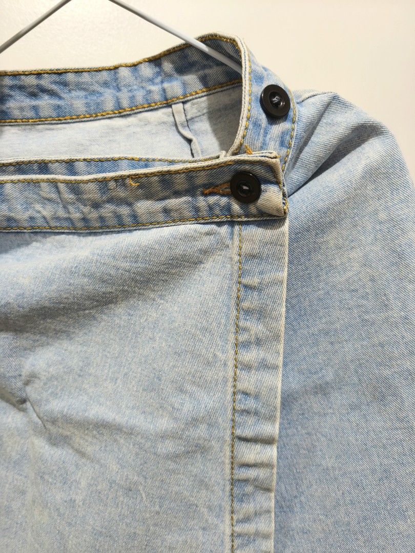 denim skirt wrap-around Light wash (Category: Skirts) located in Taguig. Submitted by deyerreC2020 (Listing ID 1467472236, Image 3). Description: nice skirt hard denim preloved skirt Light wash denim skort featuring a trendy wrap-around front with double black buttons , in good condition no flaws length: 17 waist : 26-28 & can be readjusted up to waist 32 by resetting buttons Super easy to style with your favorite crop tops and tees for a cute we