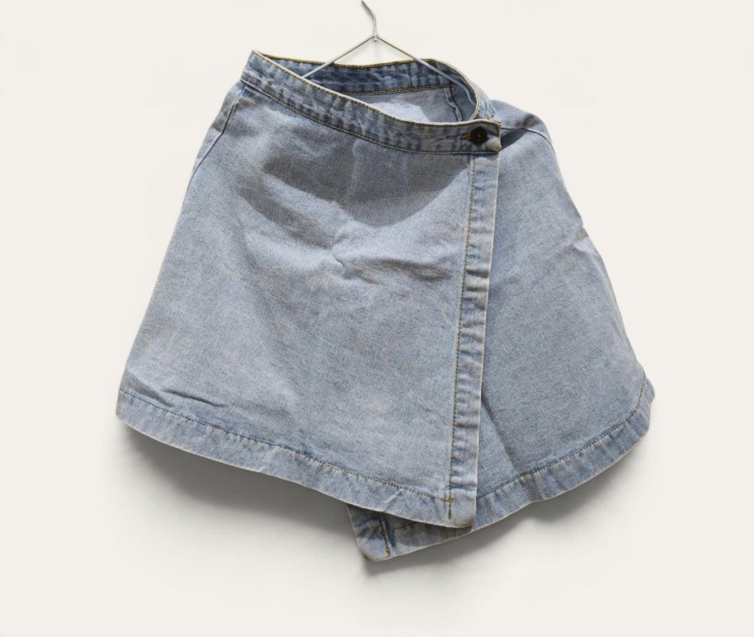 denim skirt wrap-around Light wash (Category: Skirts) located in Taguig. Submitted by deyerreC2020 (Listing ID 1467472236, Image 1). Description: nice skirt hard denim preloved skirt Light wash denim skort featuring a trendy wrap-around front with double black buttons , in good condition no flaws length: 17 waist : 26-28 & can be readjusted up to waist 32 by resetting buttons Super easy to style with your favorite crop tops and tees for a cute we