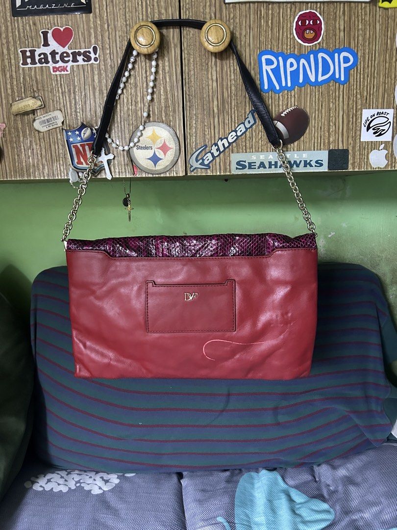 Diane Von Furstenberg Red and Purple Python Shoulder Bag (Category: Shoulder Bags) located in Quezon City. Submitted by thriftxgoods (Listing ID 1467448685, Image 2). Description: Diane Von Furstenberg convertible shoulder bag and clutch. Vibrant red leather body paired with a magenta and black python-embossed flap. Gold hardware accents with a metal frame opening and DVF logo detailing. Structured silhouette with chain-link straps and a dark pat