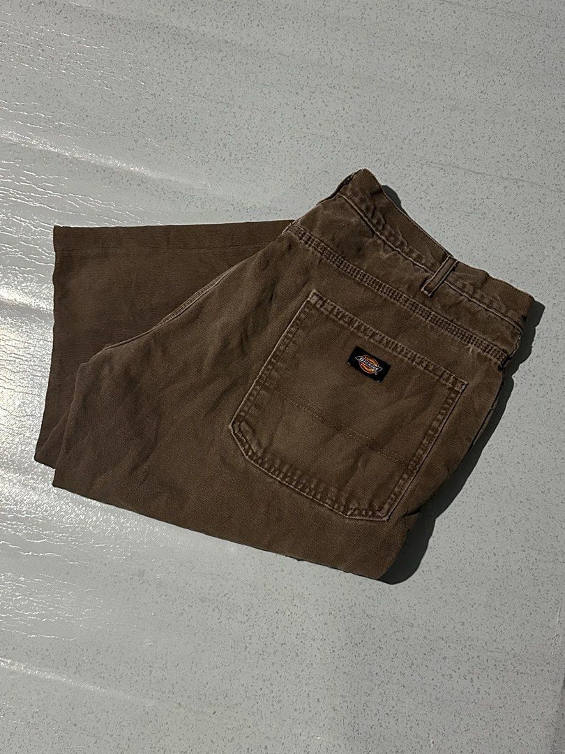 Dickies Brown Duck Canvas Flannel Lined Cargo Pants (Category: Trousers) located in Manila. Submitted by jeproxthrift (Listing ID 1467572737, Image 1). Description: - Brand: Dickies - Color: Brown - Material: Heavy-duty duck canvas with cozy plaid flannel inner waistband - Features: Hammer loop, utility pockets, and classic back pocket logo patch - Condition: Great streetwear piece with nice fade and rugged patina - Perfect for everyday wear and 
