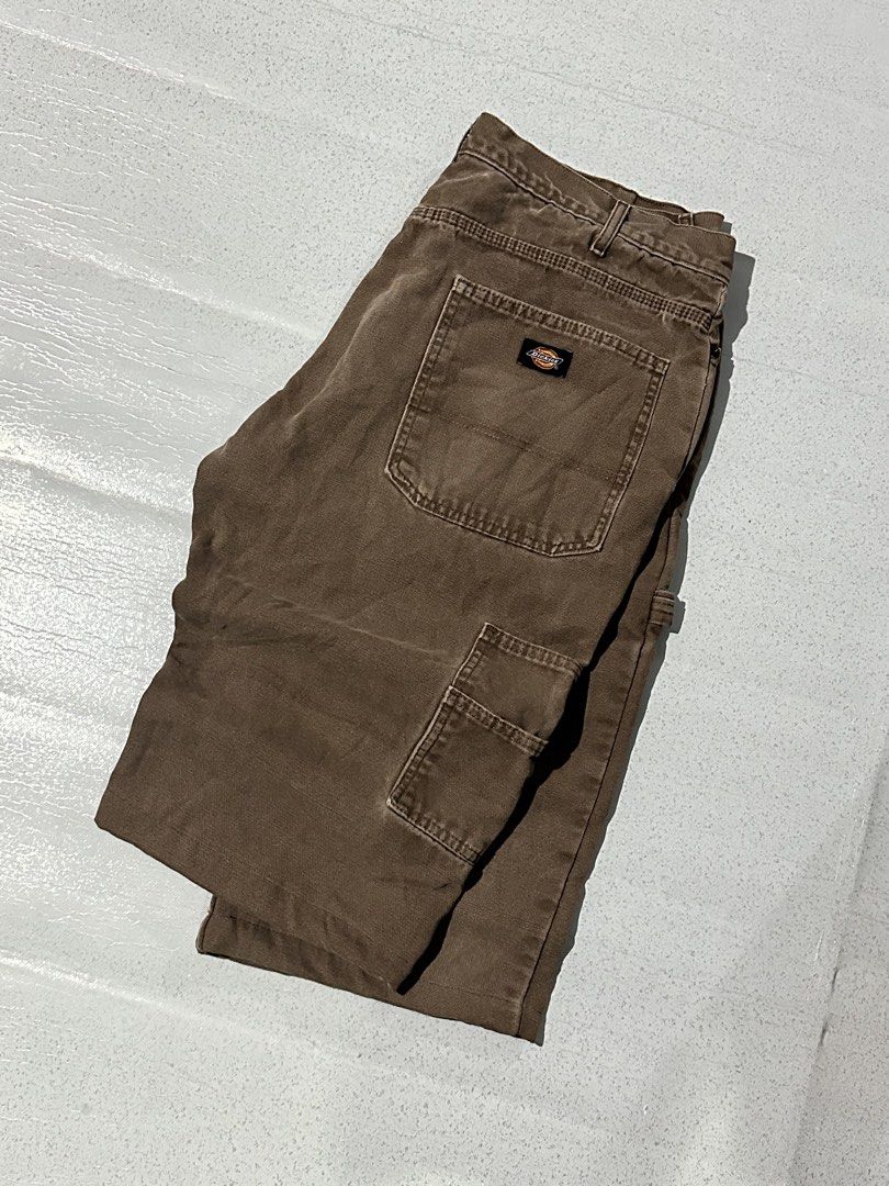 Dickies Brown Duck Canvas Flannel Lined Cargo Pants (Category: Trousers) located in Manila. Submitted by jeproxthrift (Listing ID 1467572737, Image 2). Description: - Brand: Dickies - Color: Brown - Material: Heavy-duty duck canvas with cozy plaid flannel inner waistband - Features: Hammer loop, utility pockets, and classic back pocket logo patch - Condition: Great streetwear piece with nice fade and rugged patina - Perfect for everyday wear and 