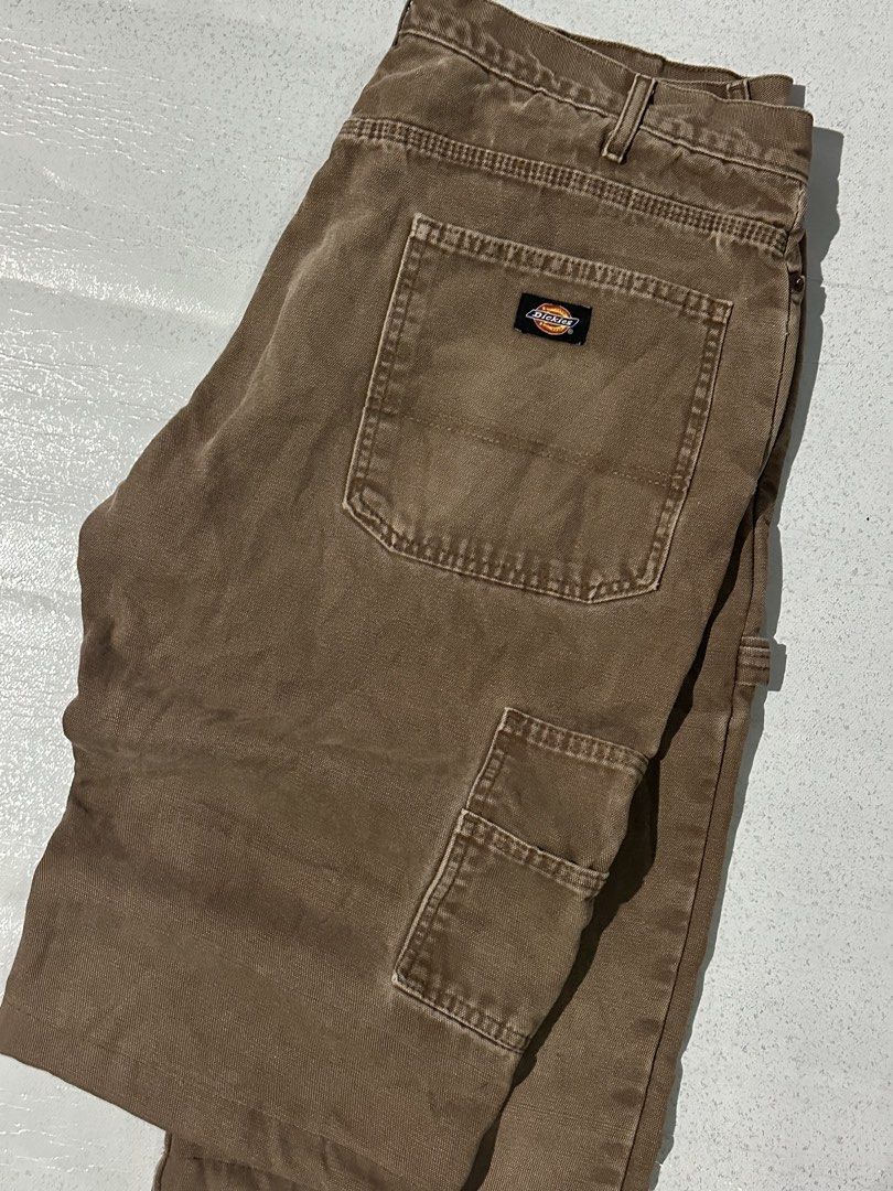 Dickies Brown Duck Canvas Flannel Lined Cargo Pants (Category: Trousers) located in Manila. Submitted by jeproxthrift (Listing ID 1467572737, Image 3). Description: - Brand: Dickies - Color: Brown - Material: Heavy-duty duck canvas with cozy plaid flannel inner waistband - Features: Hammer loop, utility pockets, and classic back pocket logo patch - Condition: Great streetwear piece with nice fade and rugged patina - Perfect for everyday wear and 