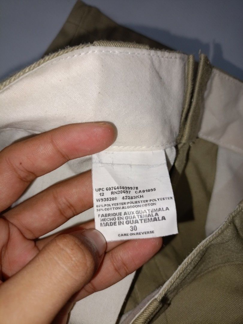Dickies Khaki Cargo Shorts Size 30 (Category: Shorts) located in Caloocan City. Submitted by grandturtle-371b8d (Listing ID 1467397692, Image 3). Description: - Brand: Dickies - Item: Men's Khaki Shorts - Size: 30 - Material: Sturdy cotton-poly blend (machine washable) - Features: Classic workwear style, signature logo patch on side pocket, back welt pockets, button waist, and zip fly - Condition: Great everyday wear with minor tiny spots visible