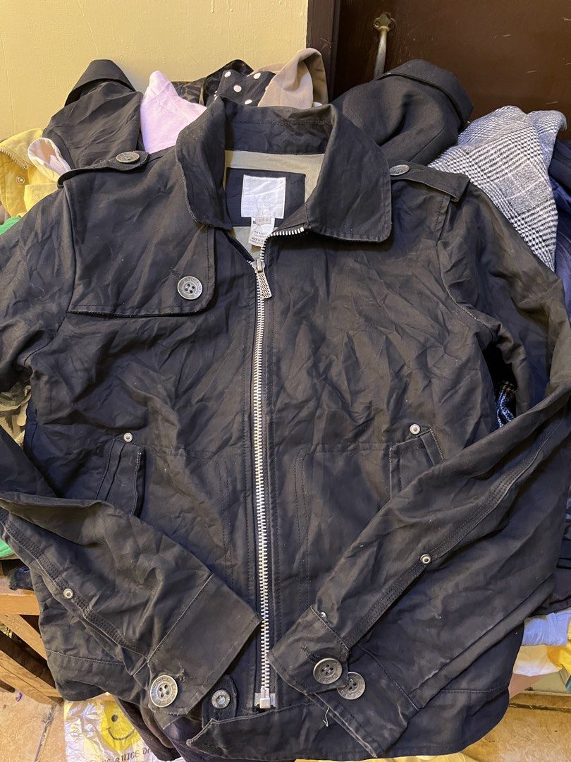 Diesel Black Cotton Zip Jacket Size L (Category: Coats, Jackets and Outerwear) located in Tabuk. Submitted by collectors_thrift_shop (Listing ID 1467490461, Image 2). Description: - Brand: Diesel - Color: Black with olive green interior lining - Size: L - Material: 100% cotton - Closure: Full front zip with custom pull tab - Details: Button accents on collar and cuffs - Pockets: Dual front pockets - Condition: Classic everyday wear piece.
