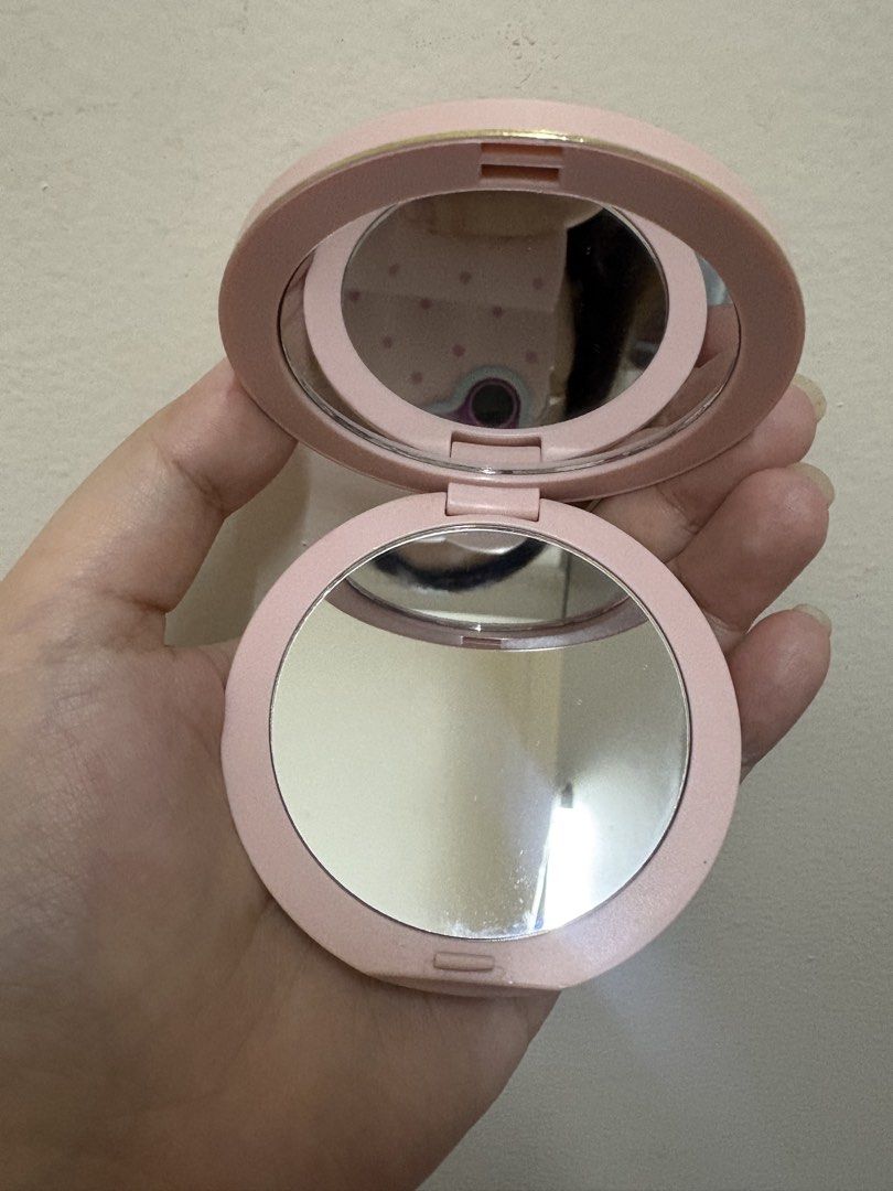 Dior Pink Quilted CD Compact Mirror (Category: Makeup) located in Manila. Submitted by alyannaros79007 (Listing ID 1467512690, Image 2). Description: - Brand: Dior - Material: Pink quilted faux leather - Design: Gold CD logo inside a stitched heart shape on the front, plain pink back - Interior: Dual mirrors for easy touch-ups - Size: Pocket-sized and compact, convenient for everyday use and travel - No more box.