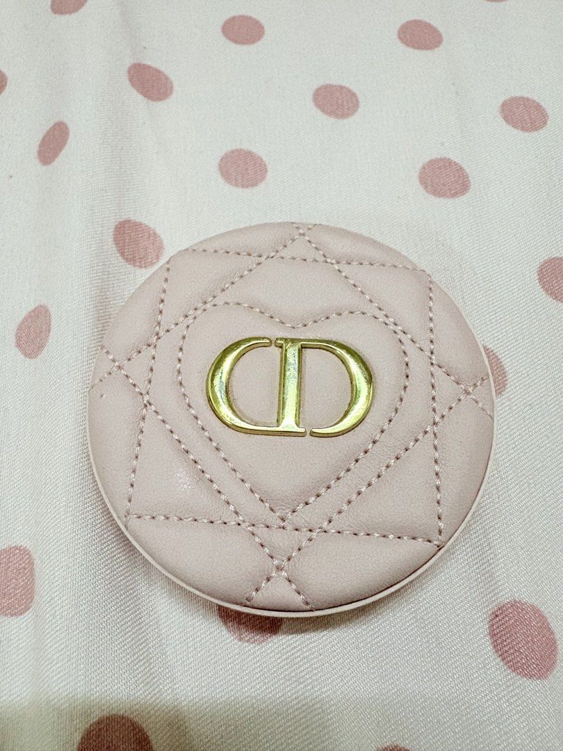 Dior Pink Quilted CD Compact Mirror (Category: Makeup) located in Manila. Submitted by alyannaros79007 (Listing ID 1467512690, Image 3). Description: - Brand: Dior - Material: Pink quilted faux leather - Design: Gold CD logo inside a stitched heart shape on the front, plain pink back - Interior: Dual mirrors for easy touch-ups - Size: Pocket-sized and compact, convenient for everyday use and travel - No more box.