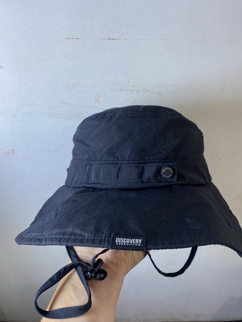 Discovery Expedition Black Bucket Hat with Chin Strap (Category: Caps & Hats) located in Manila. Submitted by kennyfranc39614 (Listing ID 1467516104, Image 2). Description: - Brand: Discovery Expedition - Color: Classic Black - Fit: Adjustable chin strap with toggle cord lock - Comfort: Mesh interior lining for extra breathability - Design: Stylish branded patches on front and brim with crown strap details - Best For: Hiking, camping, travel, and