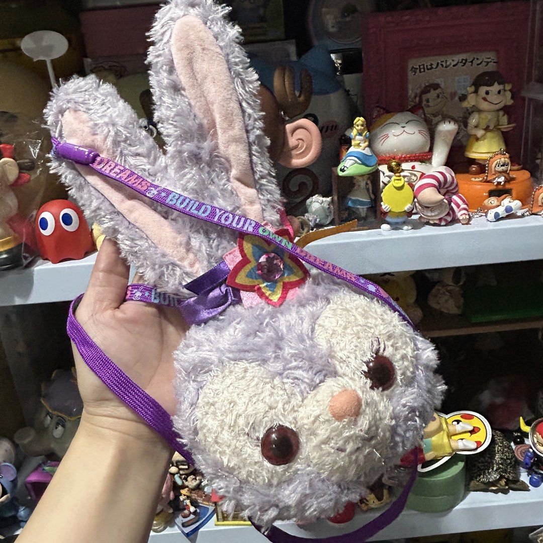 Disney Duffy Stella Lou Sling Bag (Category: Plushies & Soft Toys) located in Quezon City. Submitted by kitsune.treasures (Listing ID 1467387363, Image 1). Description: *First to pay policy! *1 day reservation only. Failure to pay on time, auto cancel. 📍Quezon City * MOD: J&T | Lalamove * MOP: GCASH | BPI 📦ON HAND AND READY TO SHIP! CONDITION: WHAT YOU SEE IS WHAT YOU GET. Dimensions: Kindly check the photos for the actual measurements. Please 
