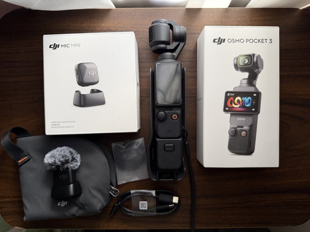 DJI Osmo Pocket 3 with DJI Mic Mini (Category: Cameras) located in Cabuyao City. Submitted by 4llie (Listing ID 1467600587, Image 1). Description: DJI Osmo Pocket 3 with DJI Mic Mini wireless transmitter ₱23,00 With screen protector. Used once only and placed in the box after. - Includes original boxes, protective pouch, windscreen, and charging cables. - Well-maintained, complete set and ready to use. RFS: Need funds for surgery MOP: Bank transf
