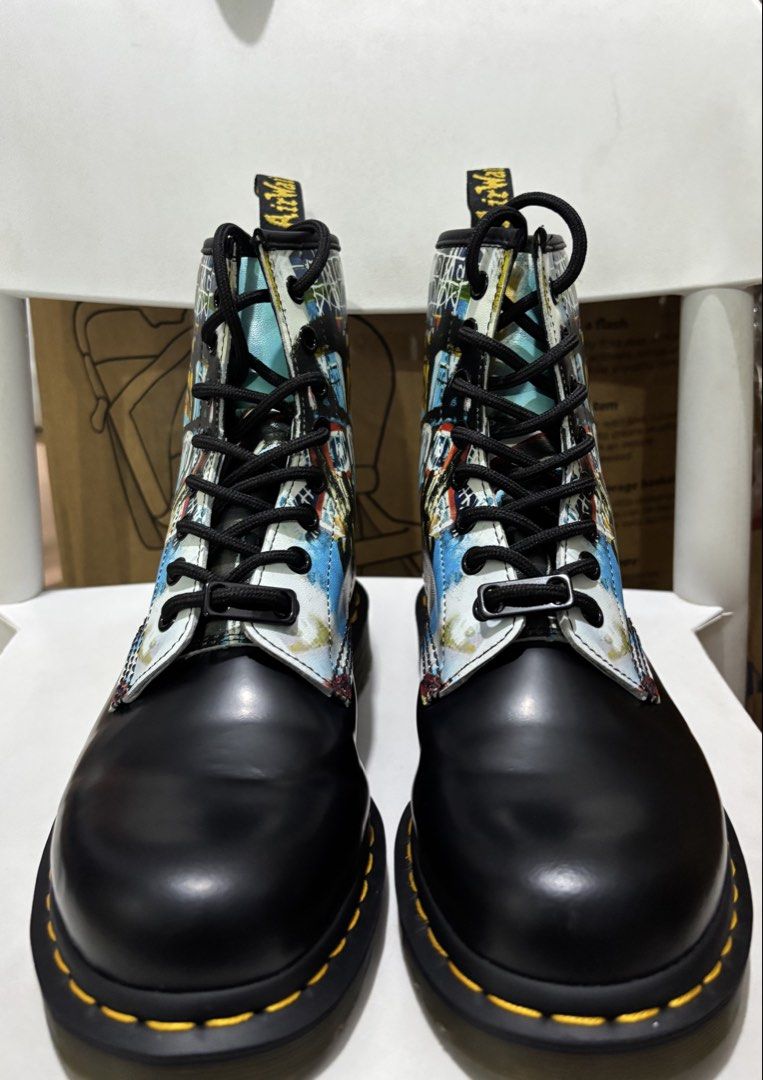Dr. Martens 1460 Basquiat II Boots (Category: Boots) located in Manila. Submitted by jonard2297 (Listing ID 1467508051, Image 3). Description: - Model: Dr. Martens 1460 Basquiat II Collaboration Boots - Size: UK 5 / US M 6 / US L 7 / EU 38 - Design: Vibrant Jean-Michel Basquiat artwork on leather upper with classic black toe cap - Details: Iconic yellow welt stitching, crown logo heel tag, and custom lace charm - Laces: Heavy-duty black laces inc