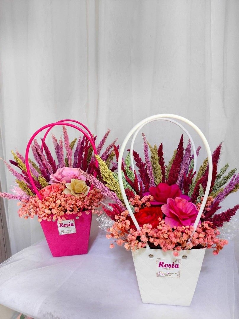 Dried Floral Arrangement Basket (Category: Flowers & Bouquets) located in San Fernando. Submitted by lrrndc (Listing ID 1467579871, Image 1). Description: - Handcrafted dried floral arrangement in a stylish basket with handles - Available color themes: Blue, Pink, Purple, Red, and Yellow - Package includes: Decorative basket, paper bag, fairy light, and a free printed greeting card - Perfect for gifts, home decor, and special occasions - Fulfillm