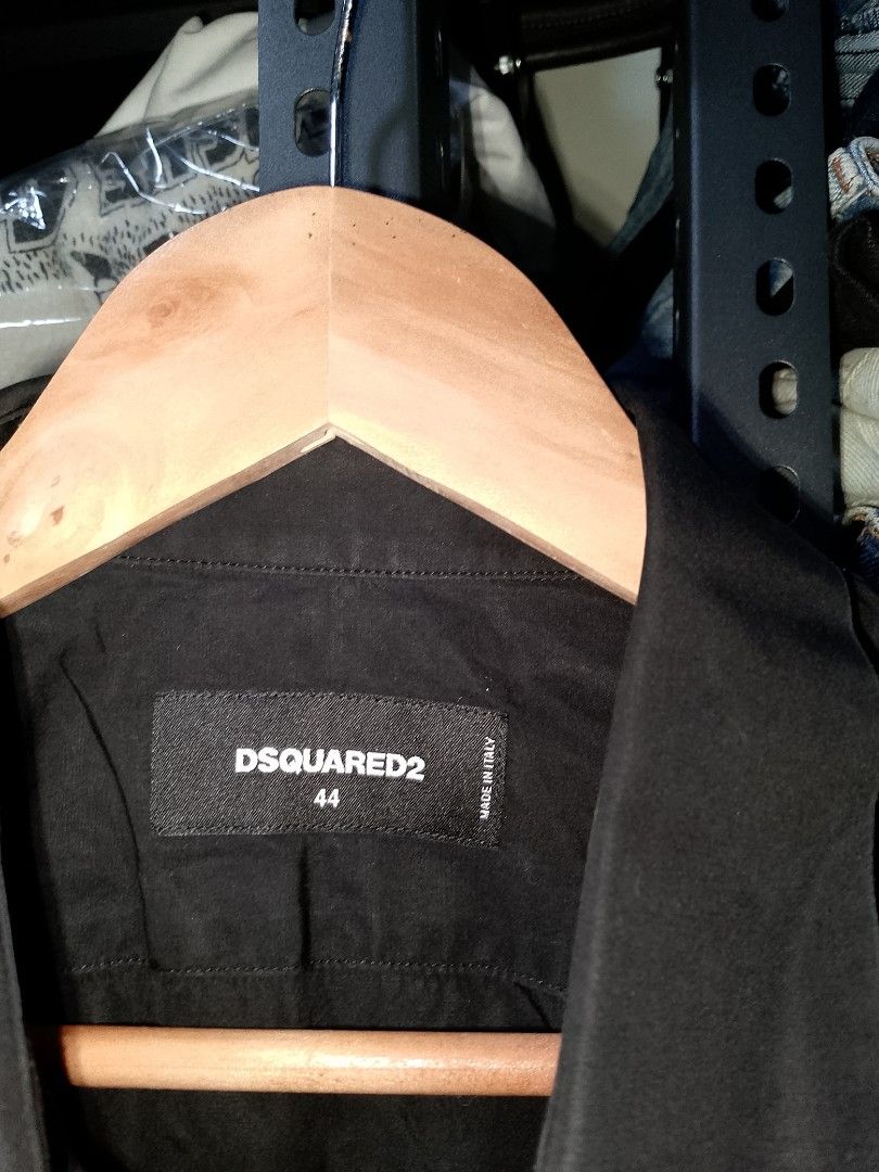 Dsquared2 Black Button-Up Shirt Size 44 (Category: Tshirts & Polo Shirts ) located in Manila. Submitted by mjthrifted_second (Listing ID 1467410975, Image 2). Description: - Brand: Dsquared2 - Made in Italy - Size: 44 (Collar tag) -Dimes: 20/29 - Color: Solid black - Details: Sparkly gold sequin 'D' letter applique on chest pocket area - Closure: Standard button-down front and cuffs - Condition: Clean and well-maintained.