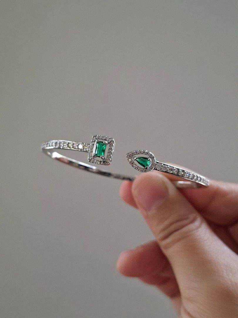 Emerald Srones and White Crystals Solid Stainless Steel Cuff Bangle Bracelet (Category: Bracelets) located in Dasmarinas. Submitted by danabrie22 (Listing ID 1467363372, Image 1). Description: very well-made, excellent crafstmanship 10/10 condition brand new stainless steel & colored cubic zirconia stones made in Hongkong.