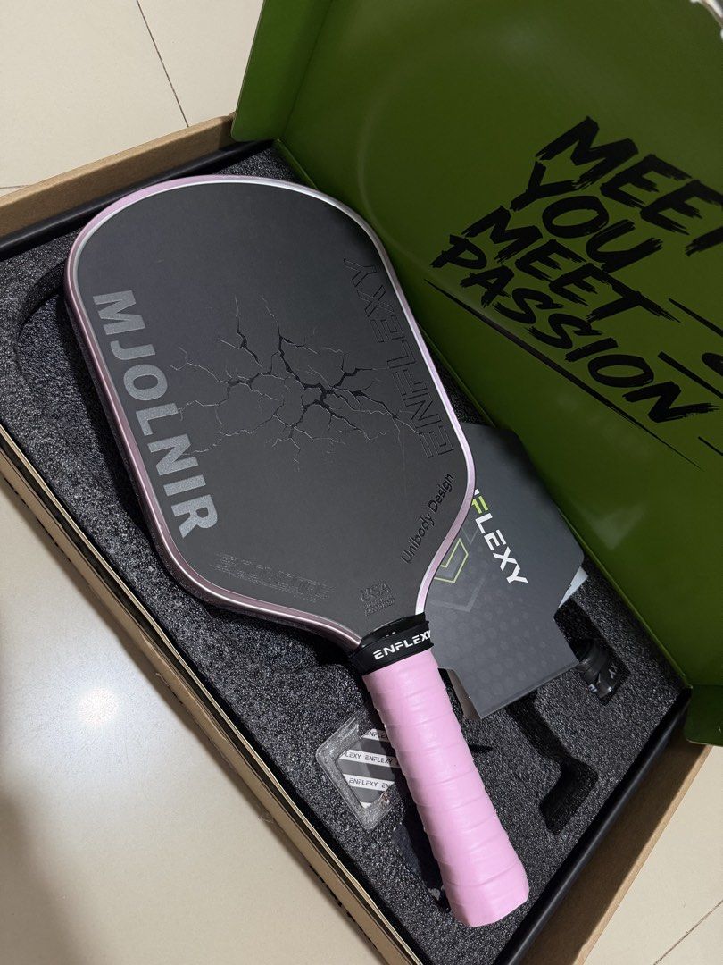 ENFLEXY Mjolnir Pickleball Paddle (Category: Racket and Ball Sports) located in Tarlac. Submitted by morii_0 (Listing ID 1467397838, Image 3). Description: - Brand: ENFLEXY Mjolnir Pickleball Paddle - Condition: used for 1 and half month only - Certification: USA Pickleball Approved (Unibody design) - Inclusions: Original green box, pink guard tape, and accessories RFS: PADDLE UPDGRADE.