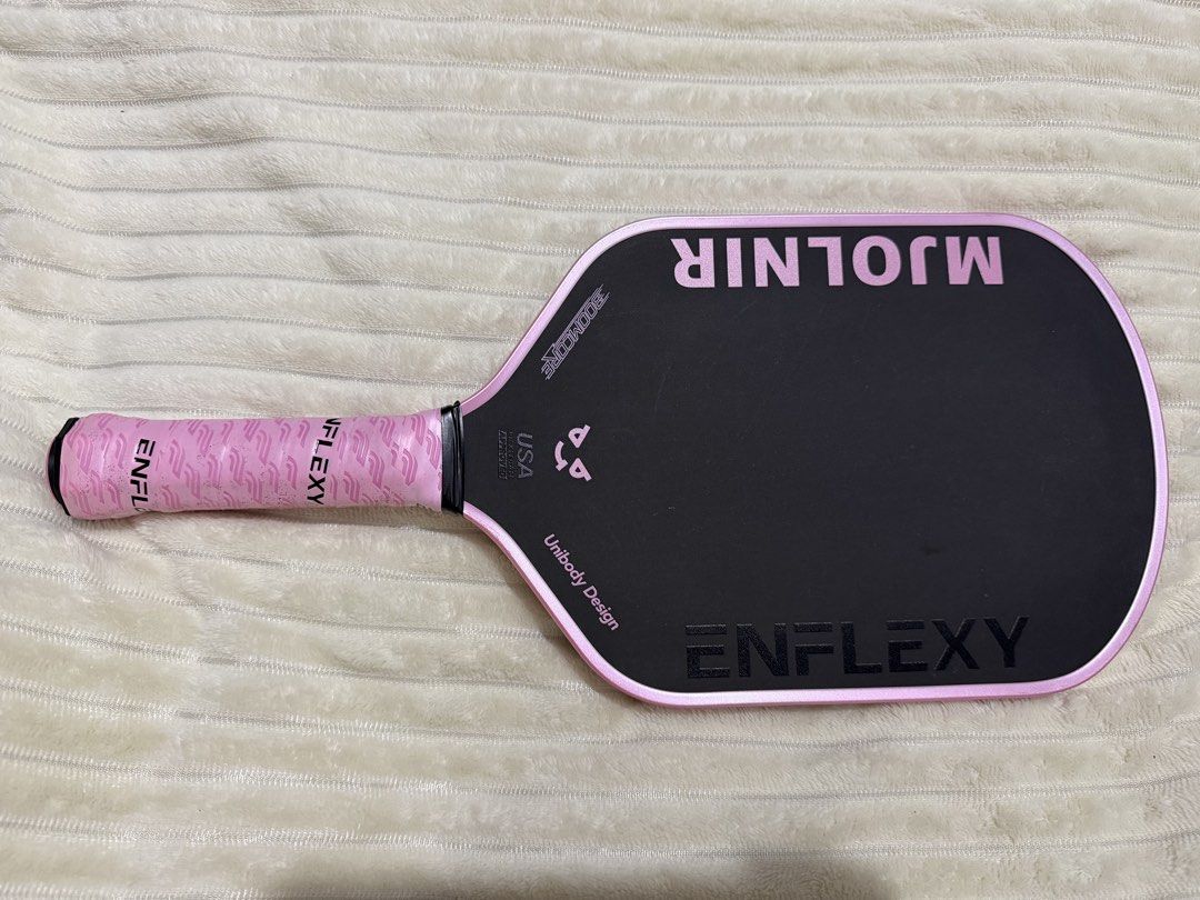 Enflexy Mjolnir Pickleball Paddle Pink (Category: Racket and Ball Sports) located in Manila. Submitted by mysticwater-3c68 (Listing ID 1467579049, Image 1). Description: Enflexy Mjolnir Pickleball Paddle - Color: Pink and Black (with comple accessories & box) - Used only once in OP - RFS: upgrading to control paddle - honest issue: slight paint chip (refer to pic) - slightly nego - buyer to shoulder delivery cost.