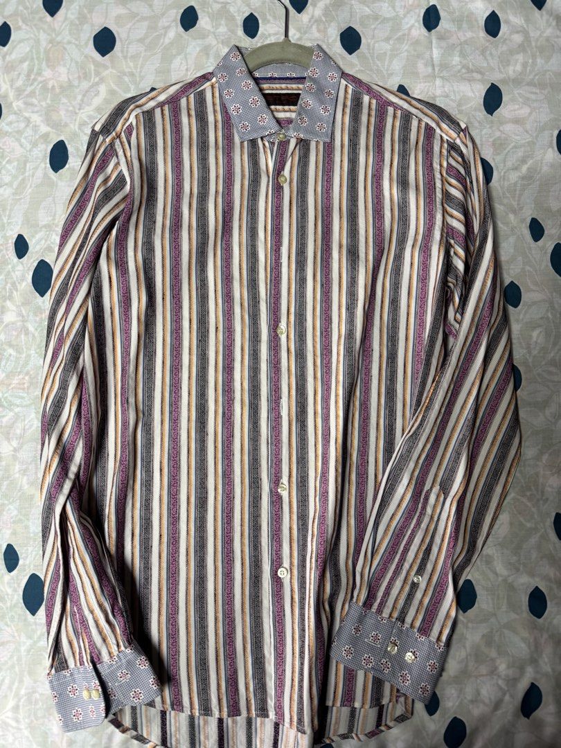 Etro Milano Striped Long Sleeve Button-Down Shirt Size 40 (Category: Longsleeves) located in Manila. Submitted by seangoart (Listing ID 1467444608, Image 1). Description: - Brand: Etro Milano - Size: 40 (tag on interior collar) - Design: Multi-color vertical stripes with contrast geometric collar and cuffs (blue, white, and burgundy tones) - Details: Classic front button placket with branded buttons - Condition: Clean fabric with sharp prints - S