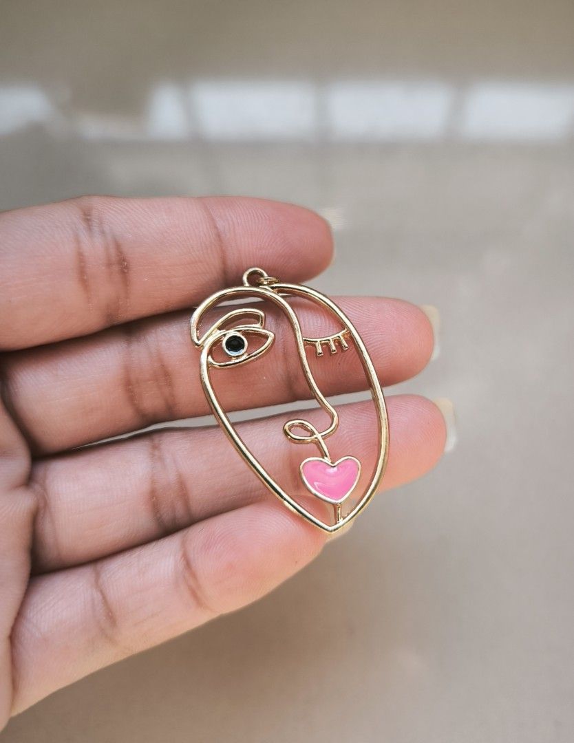 Face shape dangling earrings (Category: Earrings) located in Manila. Submitted by wearforce (Listing ID 1467514293, Image 2). Description: face shape dangling earrings brand new no issues 249 + sf.