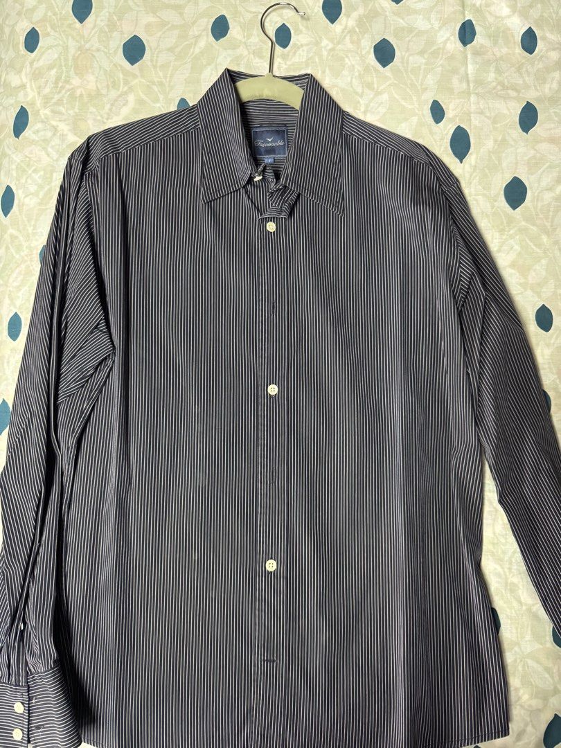 Façonnable Pinstripe Long Sleeve Button-Up Shirt (Category: Formal Shirts) located in Manila. Submitted by seangoart (Listing ID 1467444995, Image 3). Description: - Brand: Façonnable - Color: Navy blue with white pinstripes - Size: L (Tag inside collar) - Style: Long sleeves, standard collar, front button closure - Condition: Clean fabric, structured fit - Versatility: Ideal for office wear or smart-casual occasions.