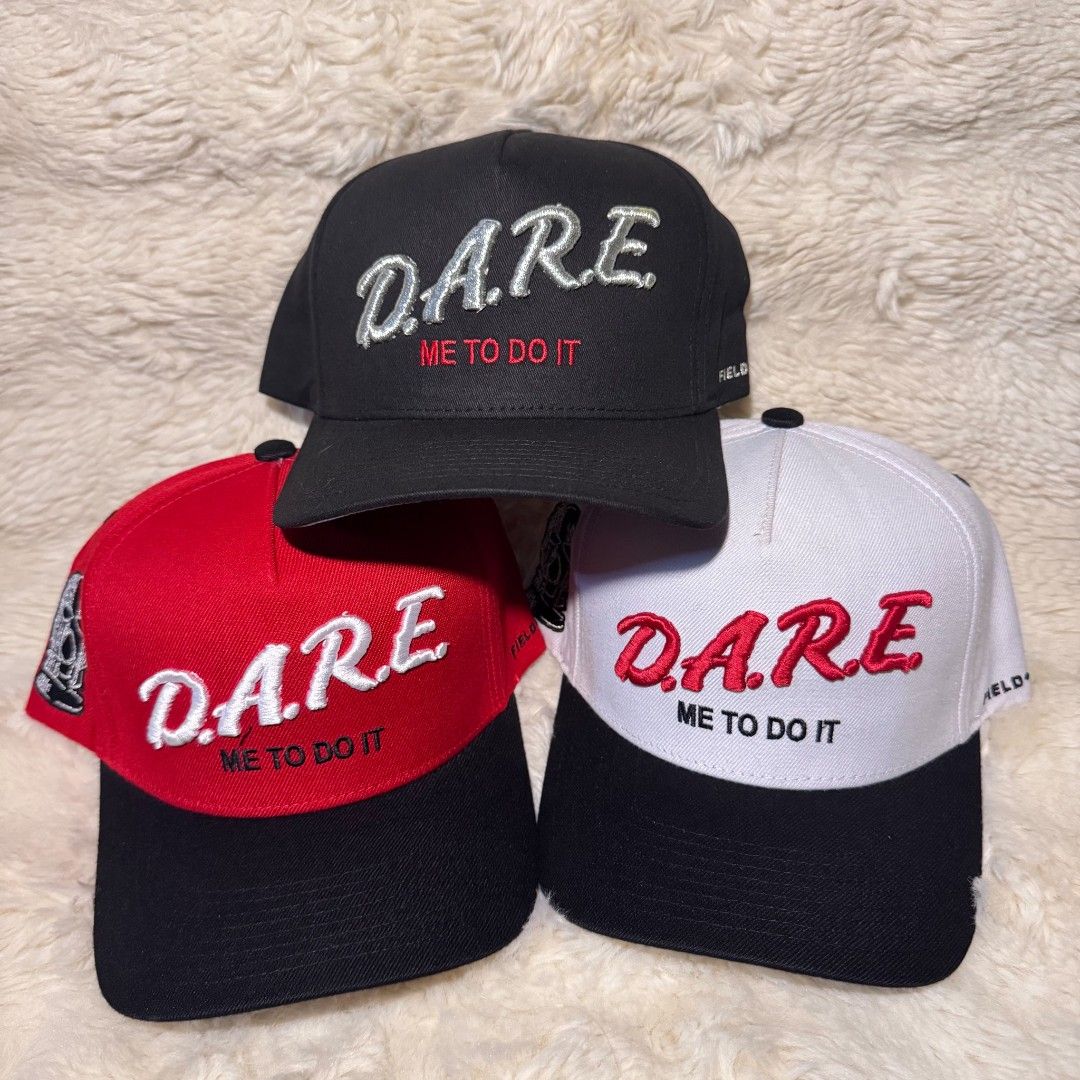 Field Grade D.A.R.E. Snapback Cap Collection (Category: Caps & Hats) located in Manila. Submitted by westcity.mnl (Listing ID 1467512019, Image 1). Description: - Brand: Field Grade - Design: D.A.R.E. embroidery on front, 'ME TO DO IT' under the brim, and ski mask graphic on the side - Fit: Adjustable snap closure - Details: Interior branding tags and taping included - Colors available: Black, Red, and White - Condition: Brand New.