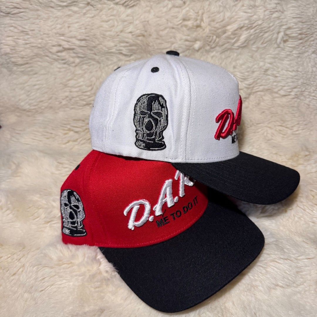 Field Grade D.A.R.E. Snapback Cap Collection (Category: Caps & Hats) located in Manila. Submitted by westcity.mnl (Listing ID 1467512019, Image 2). Description: - Brand: Field Grade - Design: D.A.R.E. embroidery on front, 'ME TO DO IT' under the brim, and ski mask graphic on the side - Fit: Adjustable snap closure - Details: Interior branding tags and taping included - Colors available: Black, Red, and White - Condition: Brand New.