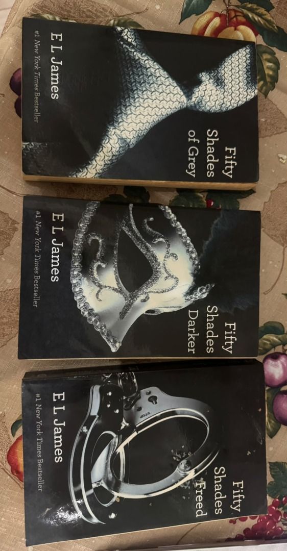 Fifty Shades Trilogy by E L James Paperback Set (Category: Storybooks) located in Paranaque City. Submitted by jiggybautista (Listing ID 1467364106, Image 3). Description: - Title: Fifty Shades Trilogy (Fifty Shades of Grey, Fifty Shades Darker, Fifty Shades Freed) - Author: E L James - Format: Paperback with black covers - Condition: Read once; spines and covers intact, minor natural yellowing on pages - Ideal for: Romance and drama fans wanting