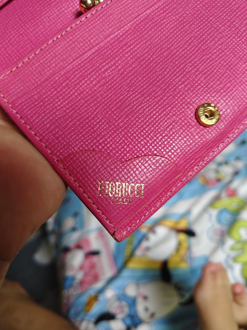 Fiorucci Hot Pink Leather Wallet (Category: Wallets & Card holders) located in General Mariano Alvarez. Submitted by findsandmoreph (Listing ID 1467368659, Image 3). Description: Authentic Vintage Fiorucci Italy Wallet (Fuchsia Pink) ✨ Price: ₱1500 (Slightly negotiable for serious buyers) Add a pop of retro-Y2K aesthetic to your style with this rare vintage find! This is a 100% original Fiorucci Italy wallet,It features a stunning fuchsia pink sa