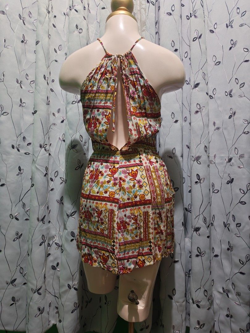 Floral Halter Neck Romper Multi-colored (Category: Rompers) located in Caloocan City. Submitted by _misskaye (Listing ID 1467476591, Image 3). Description: - Multi-colored vintage floral tile print - Halter neck with a cute open back and tie closure - Comfortable elasticized waist for easy wear - Lightweight and breezy fabric ideal for beach trips and warm weather.