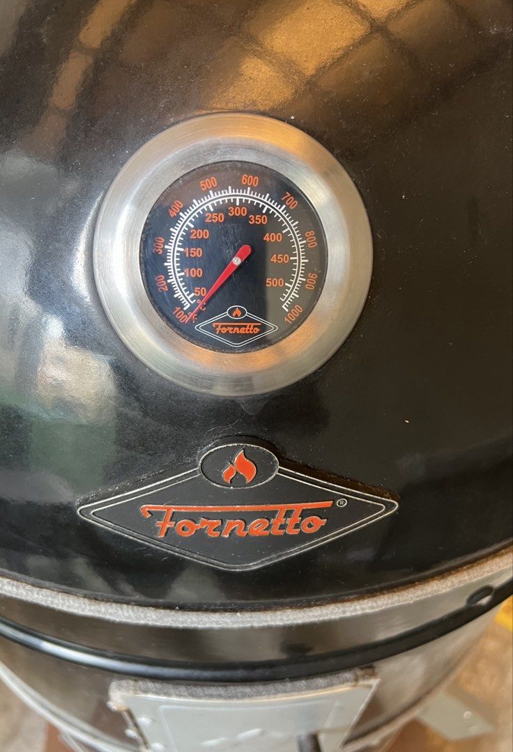 Fornetto Basso 22” Vertical Bullet Smoker (Category: BBQ, Grills & Hotpots) located in Mandaluyong City. Submitted by maropa (Listing ID 1467273170, Image 2). Description: - Sleek black Fornetto smoker grill, perfect for backyard BBQ and smoking - Price is negotiable. Make a reasonable offer if interested. - Multi-tier setup with a built-in lid thermometer for precise temperature control - Two side access doors featuring secure latches for easy f