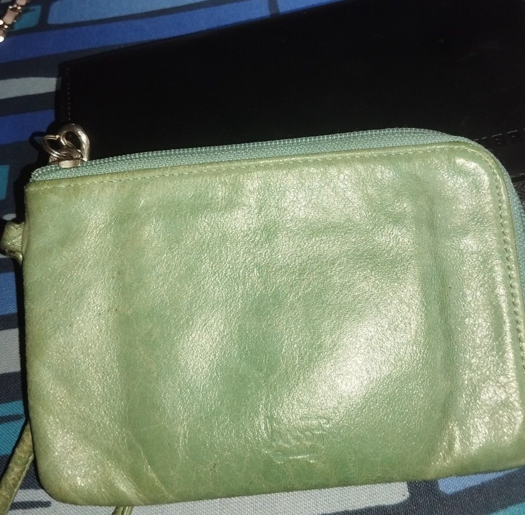 Fossil Green Leather Zip Around Wallet (Category: Wallets & Card holders) located in Manila. Submitted by lene48 (Listing ID 1467402662, Image 1). Description: - Brand: Fossil - Material: Soft textured green leather - Closure: Secure zip-around design - Features: Embossed logo, handy side wristlet strap, compact size - Condition: Normal signs of use around the edges, with starbucks long organizer, 2 for 280..