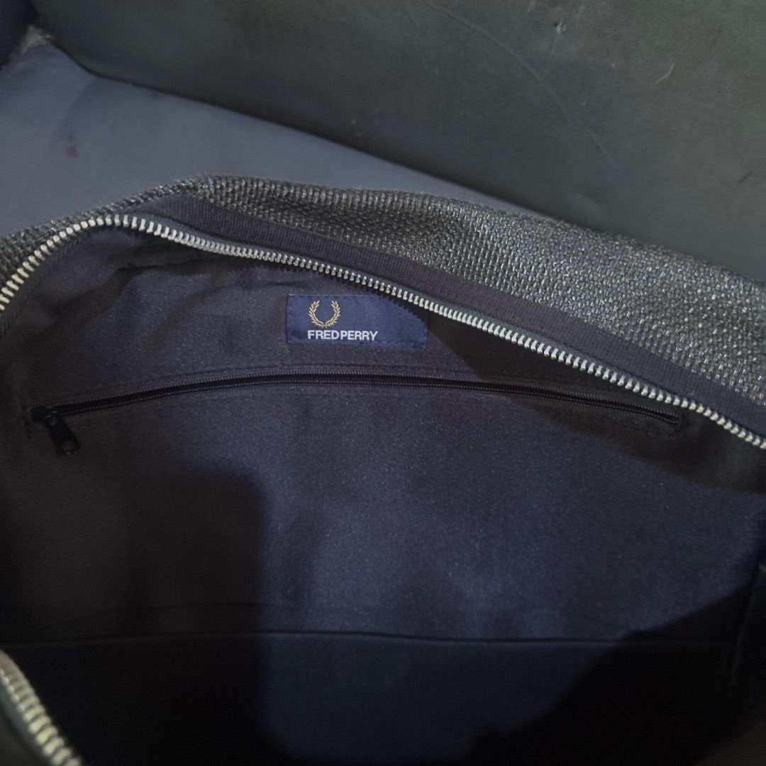 Fred Perry Black Shoulder/Messenger Bag (Category: Sling Bags) located in Cagayan de Oro. Submitted by caspian_thrift (Listing ID 1467371377, Image 2). Description: Excellent Condition 11x14 in. kasya laptop issue: minimal bakbak lang sa logo sa front, safe declaration lang incase maselan ka pero as you can see sa pic di naman gano halata.