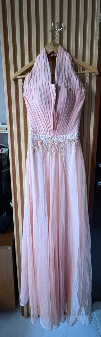 Frederick Peralta Light Pink Halter Evening Dress (Category: Evening dresses & gowns) located in Paranaque City. Submitted by marketbasket (Listing ID 1467543034, Image 1). Description: - Designer: Frederick Peralta - Color: Light pink - Style: Halter neck evening gown with a full-length flowing chiffon skirt - Bodice: Pleated with a plunging neckline and detailed beaded waistband - Interior: Fully lined satin with built-in bust structure for sup
