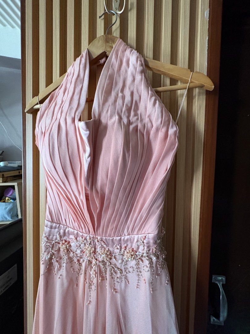 Frederick Peralta Light Pink Halter Evening Dress (Category: Evening dresses & gowns) located in Paranaque City. Submitted by marketbasket (Listing ID 1467543034, Image 2). Description: - Designer: Frederick Peralta - Color: Light pink - Style: Halter neck evening gown with a full-length flowing chiffon skirt - Bodice: Pleated with a plunging neckline and detailed beaded waistband - Interior: Fully lined satin with built-in bust structure for sup