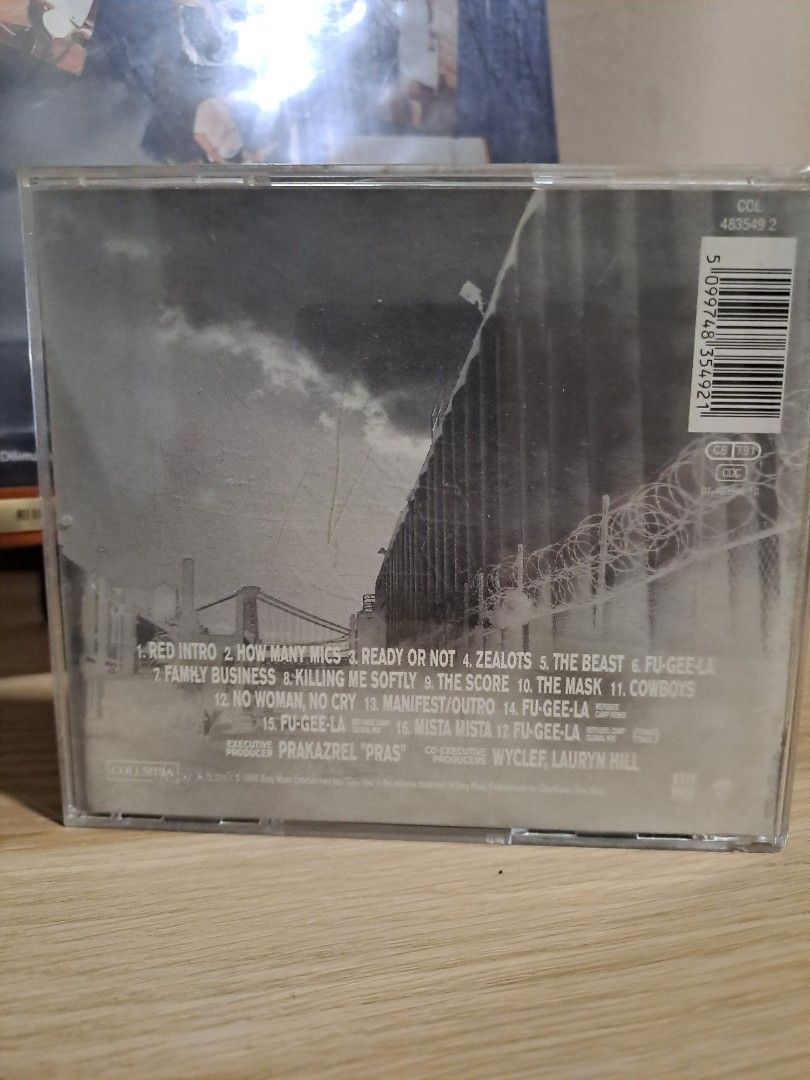Fugees The Score CD Album (Category: CDs & DVDs) located in Las Pinas. Submitted by cobieshop (Listing ID 1467505731, Image 2). Description: - Artist/Album: Fugees - The Score (Standard Audio CD) - Format: Jewel case with back inlay and barcode (5 099748 354921) - Label: Columbia Records - Hit Tracks: Includes 'Killing Me Softly', 'Ready or Not', and more - Condition: Plastic case shows minor scuffs and wear from age, but overall well-preserved.