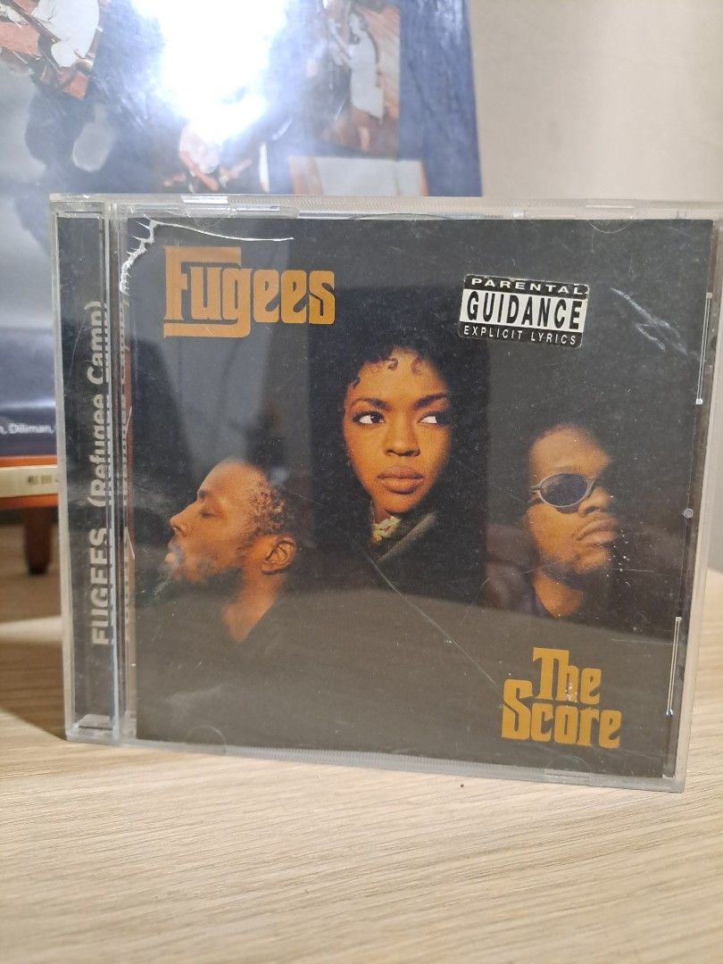 Fugees The Score CD Album (Category: CDs & DVDs) located in Las Pinas. Submitted by cobieshop (Listing ID 1467505731, Image 1). Description: - Artist/Album: Fugees - The Score (Standard Audio CD) - Format: Jewel case with back inlay and barcode (5 099748 354921) - Label: Columbia Records - Hit Tracks: Includes 'Killing Me Softly', 'Ready or Not', and more - Condition: Plastic case shows minor scuffs and wear from age, but overall well-preserved.