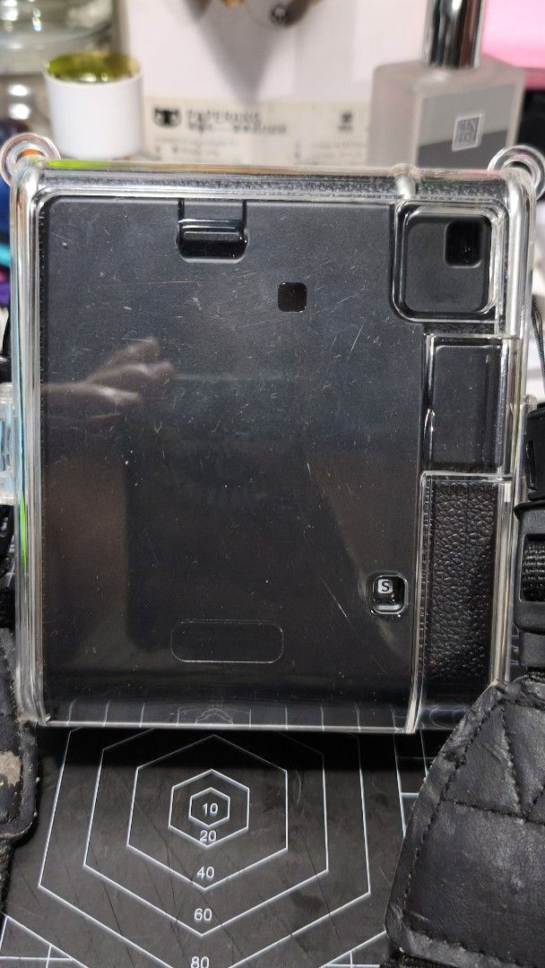 Fujifilm Instax Mini 40 Instant Camera with Clear Case and Strap (Category: Cameras) located in Manila. Submitted by girlcaboodle.2 (Listing ID 1467598438, Image 3). Description: - Fujifilm Instax Mini 40 instant camera in a classic black textured finish - Includes matching black strap and a pre-attached transparent protective case - Uses standard AA alkaline batteries (clean compartment, ready to use) - Features a built-in flash and 60mm Instax 