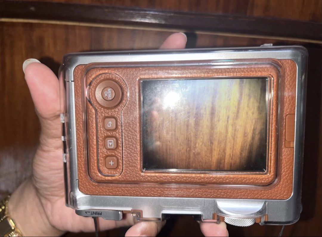 Fujifilm Instax Mini Evo (Category: Cameras) located in Dumaguete. Submitted by sellie06 (Listing ID 1467362873, Image 2). Description: Key Features Creative Effects: Combine 10 lens settings (like vignette and fisheye) with 10 film filters for 100 different looks. •Hybrid Functionality: Shoot digitally, preview shots on the 3.0-inch LCD screen, save them to internal memory or a microSD card, and choose which ones to print. •Smartphone Integratio