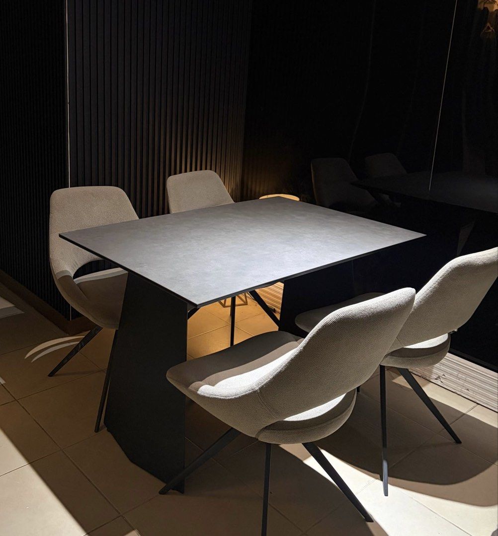 Furniture Republic Dining Set Premium Quality (Category: Tables & Sets) located in Manila. Submitted by iammaleficent18 (Listing ID 1467510282, Image 3). Description: - Dark grey sintered stone top dining table with sturdy black metal legs - Includes 4 dining chairs (One chair has minor defect but the chair is still perfectly usable) - Selling as a complete set only - Self-pickup required due to size -Dining table dimension: 80cm x 120cm Brand: F
