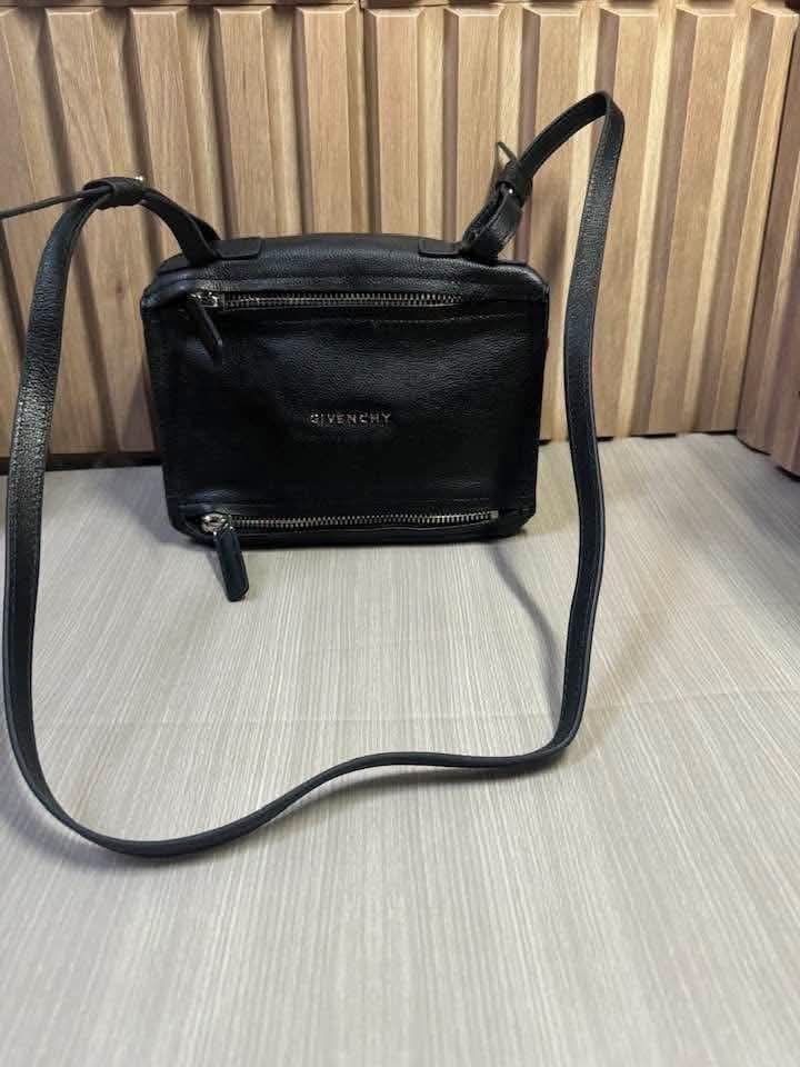 G i v e n c h y Sling bag (Category: Cross-body Bags) located in Cavite. Submitted by rsfleur (Listing ID 1467464170, Image 1). Description: Material: Genuine leather - Details: Dark leather shoulder strap, trim, and silver-tone hardware - Accessories: Bag only - Interior: Grey fabric lining with a convenient side slip pocket and secure zipper closure - Condition: well-maintained - Meetup or shipping options available across the Philippines.