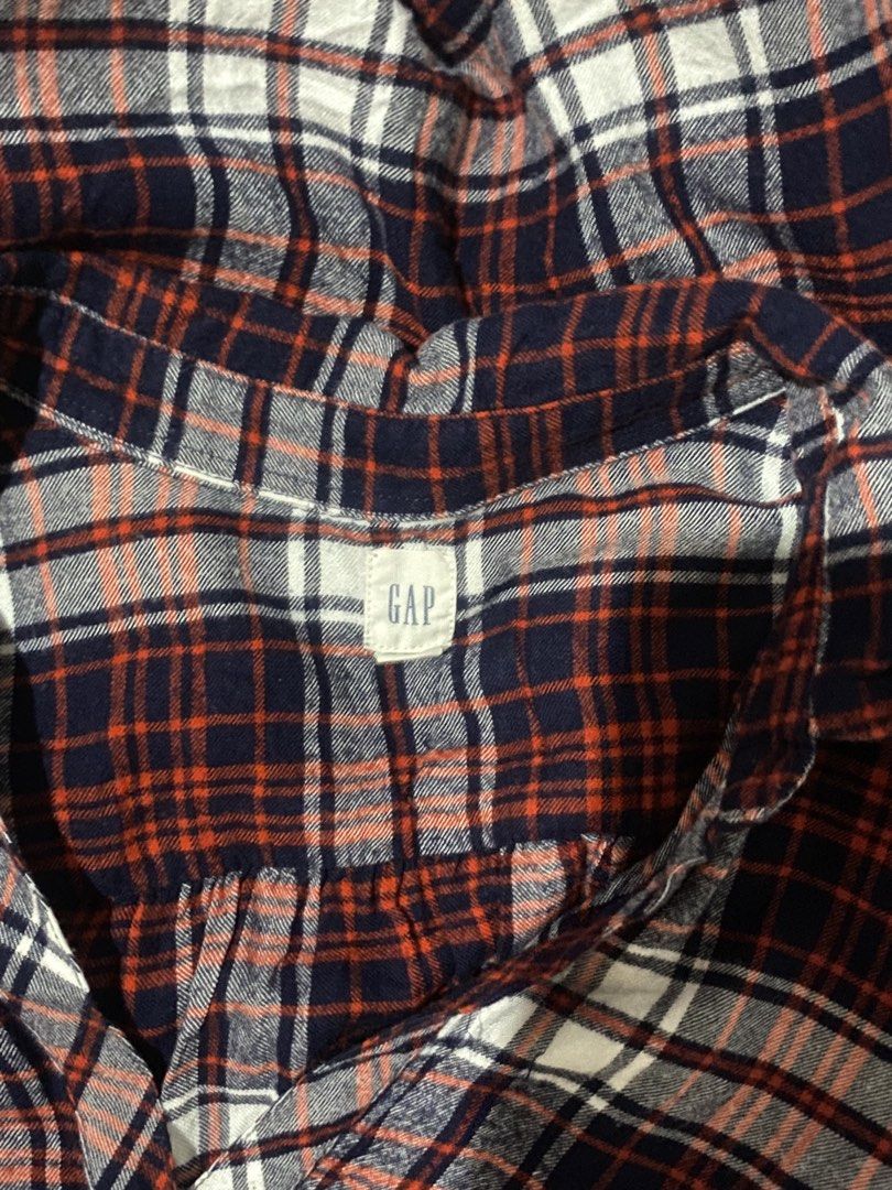 GAP Plaid Long Sleeve Button-Up Blouse (Category: Longsleeves) located in Santiago. Submitted by jy.collection (Listing ID 1467390422, Image 2). Description: - Brand: GAP - Design: Classic red, navy blue, and white plaid - Material: Soft, cozy flannel (great for layering) - Fit: Relaxed fit with V-neck collar, front button placket, and button cuffs - Condition: Excellent pre-loved condition - Mode of Payment: GCash or BPI - Shipping: Via J&T Expr