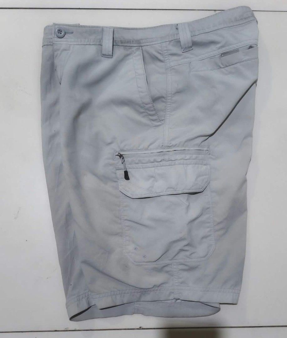 George grey cargo shorts size 32 (Category: Shorts) located in San Carlos City. Submitted by dhong_abay_thrift (Listing ID 1467433825, Image 2). Description: - Brand/Model: George Cargo Shorts - Size: 32 (Made in Vietnam) - Color: Grey - Material: Lightweight and comfortable - Pockets: Multiple utility pockets with secure zipped compartments on sides and back - Closure: Button closure with belt loops - Condition: Clean stitching throughout, excel